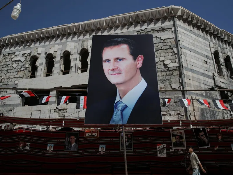 Poster cu Assad în Douma/ Foto: Reuters